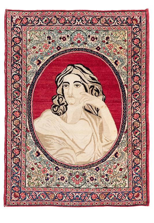 An antique pictoral Kerman Raver rug, c. 87 x 65 cm.