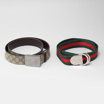 Two Gucci belts.
