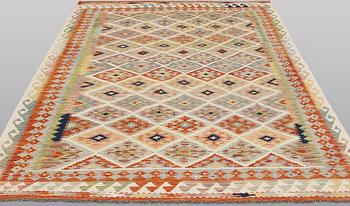 A kilim rug, approx. 250 x 173 cm.