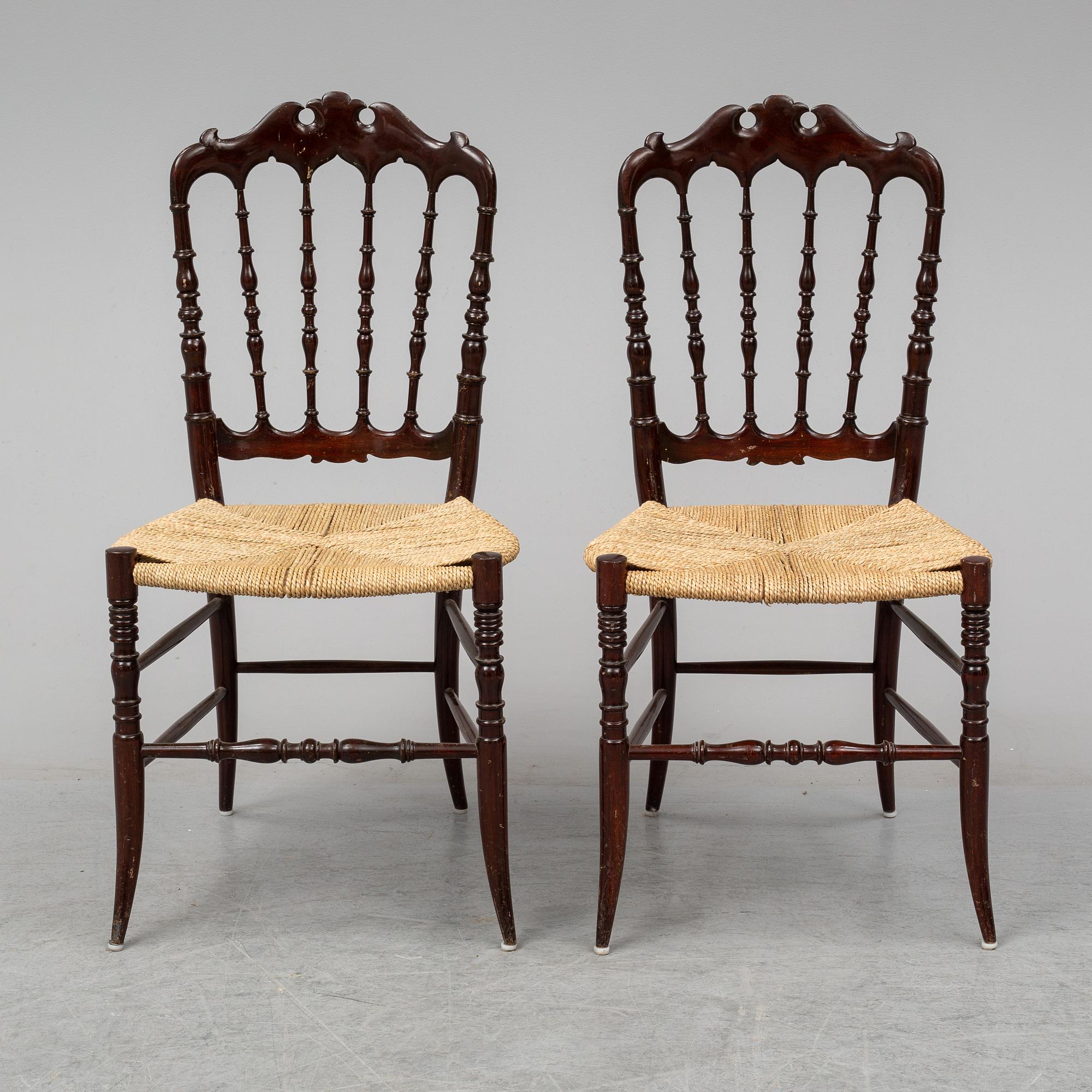 A pair of Chiavari chairs.