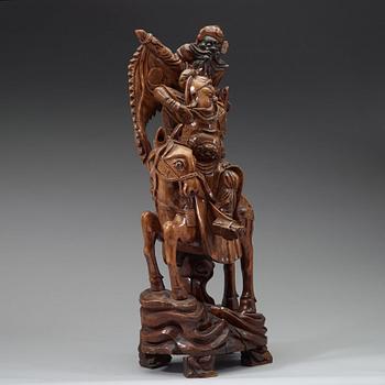 A large wooden sculpture group of Guandi on horseback and an attendant, Qing dynasty (1644-1912).