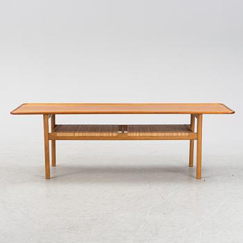 An oak and tek coffee table by Hans J Wegner for Andreas Tuck, 1960s.