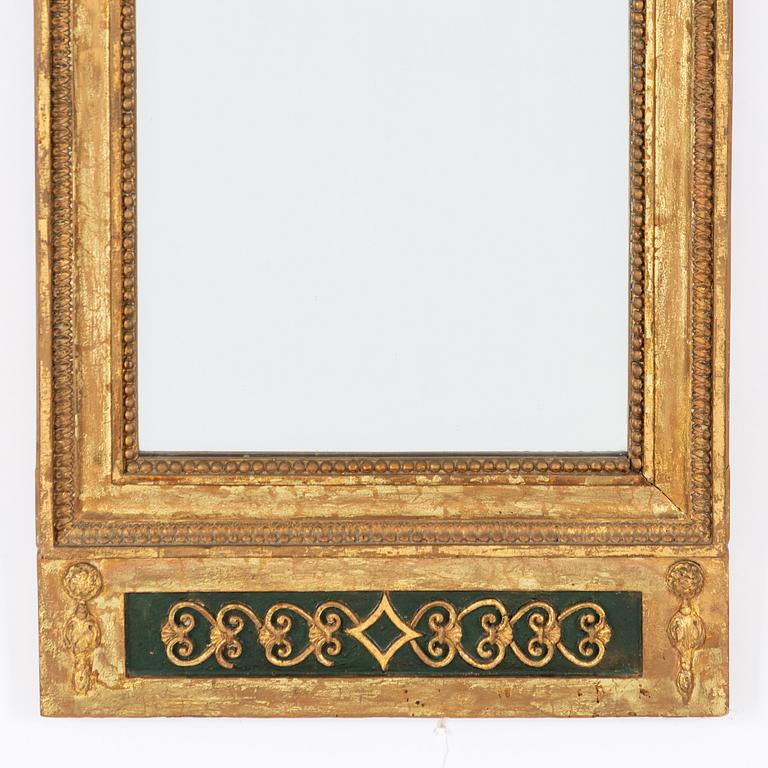 An Empire mirror, first half of the 19th Century.