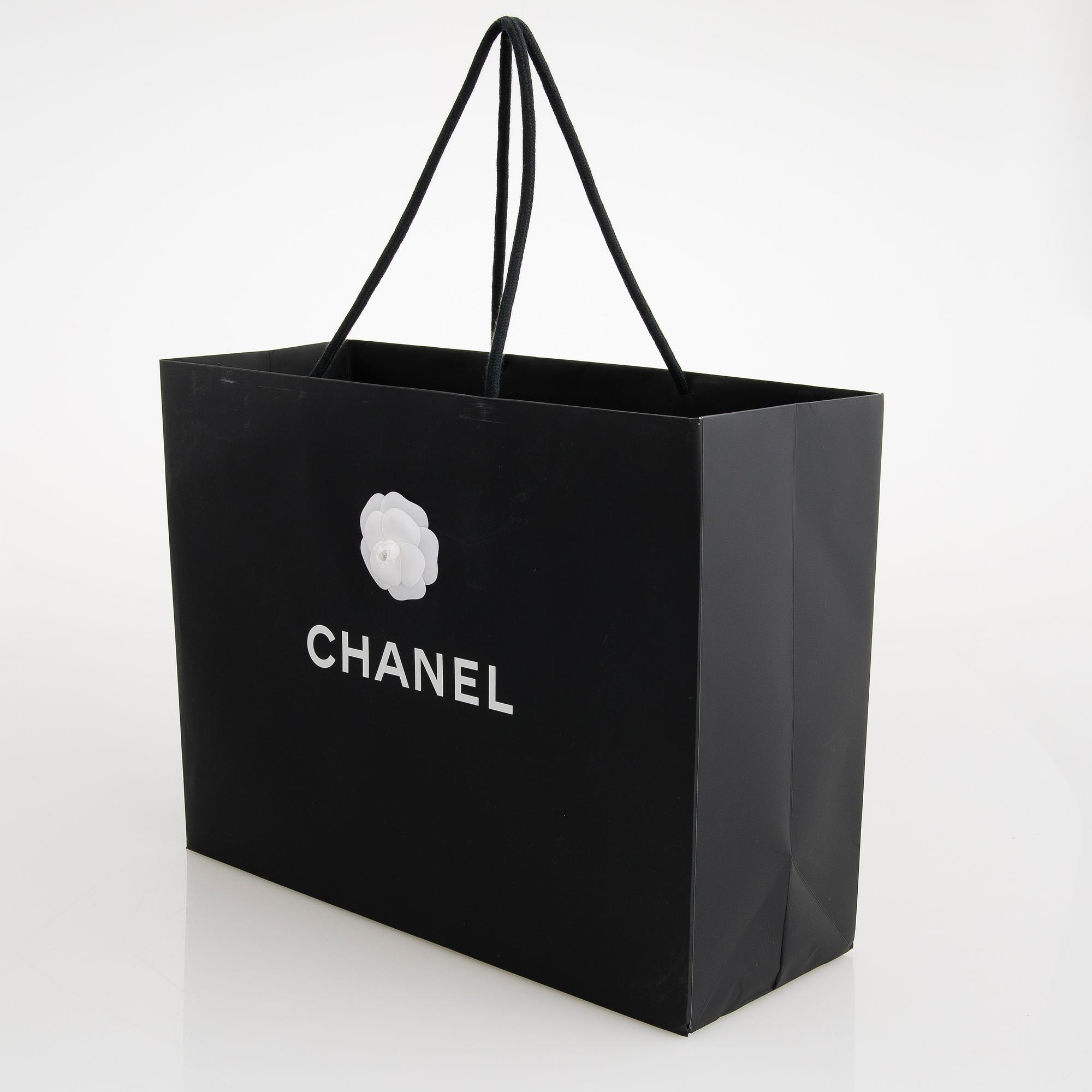 CHANEL, A Large Black Leather Shopping Bag.