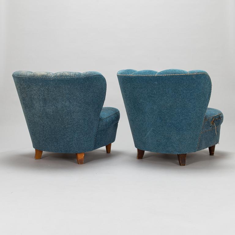 A pair of mid-20th-century armchairs.