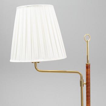 A pair of brass and leather floor lights, Örsjö Industri, 21st century.