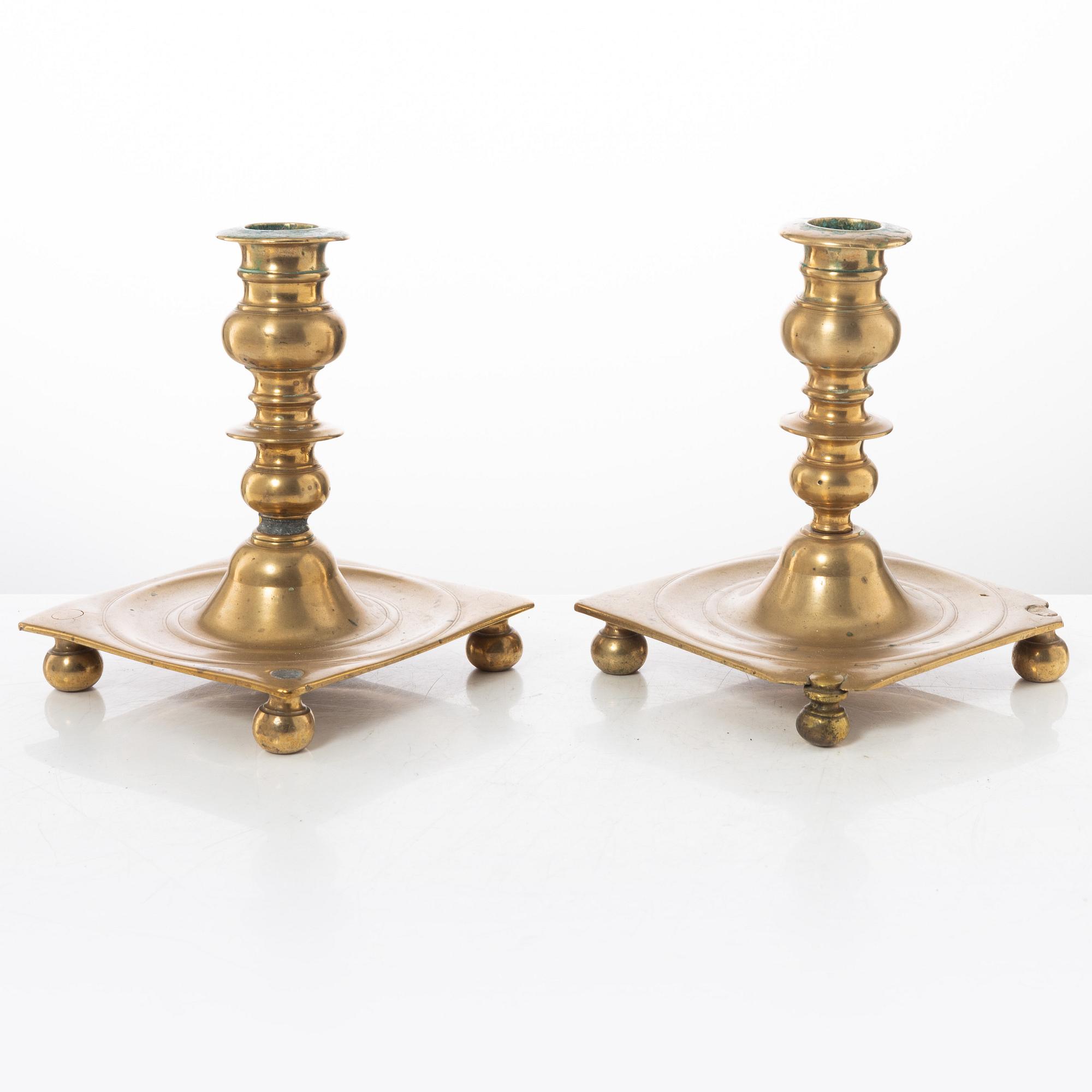 A pair of North European baroque brass candlesticks, circa 1700.