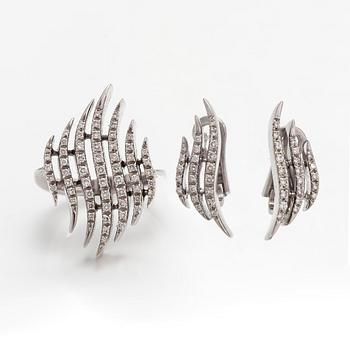A pair of 18K white gold earrings and a ring with diamonds ca. 0.90 ct in total. Moscow.