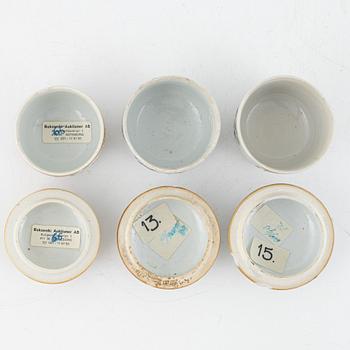 Three porcelain cups with covers, China, Qing dynasty, 18th century.