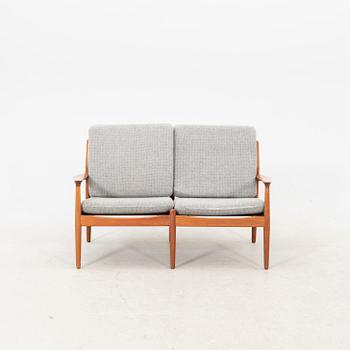 A Grete Jalk teak armchair and sofa from Glostrup Denmark, 1960s, marked.