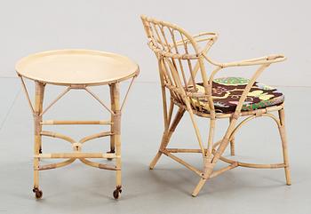 A rattan armchair and table attributed to Josef Frank, Svenskt Tenn.