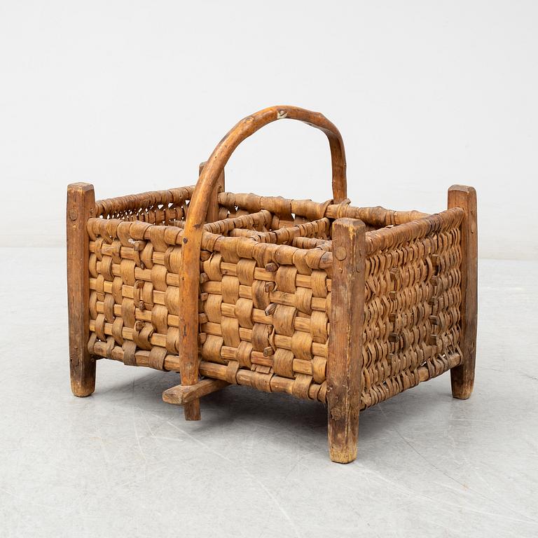 A 19th century wine bottle basket.