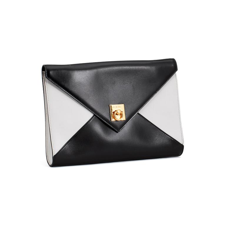 CÉLINE, a black and white leather clutch.