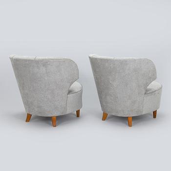 A pair of mid 20th century armchairs.