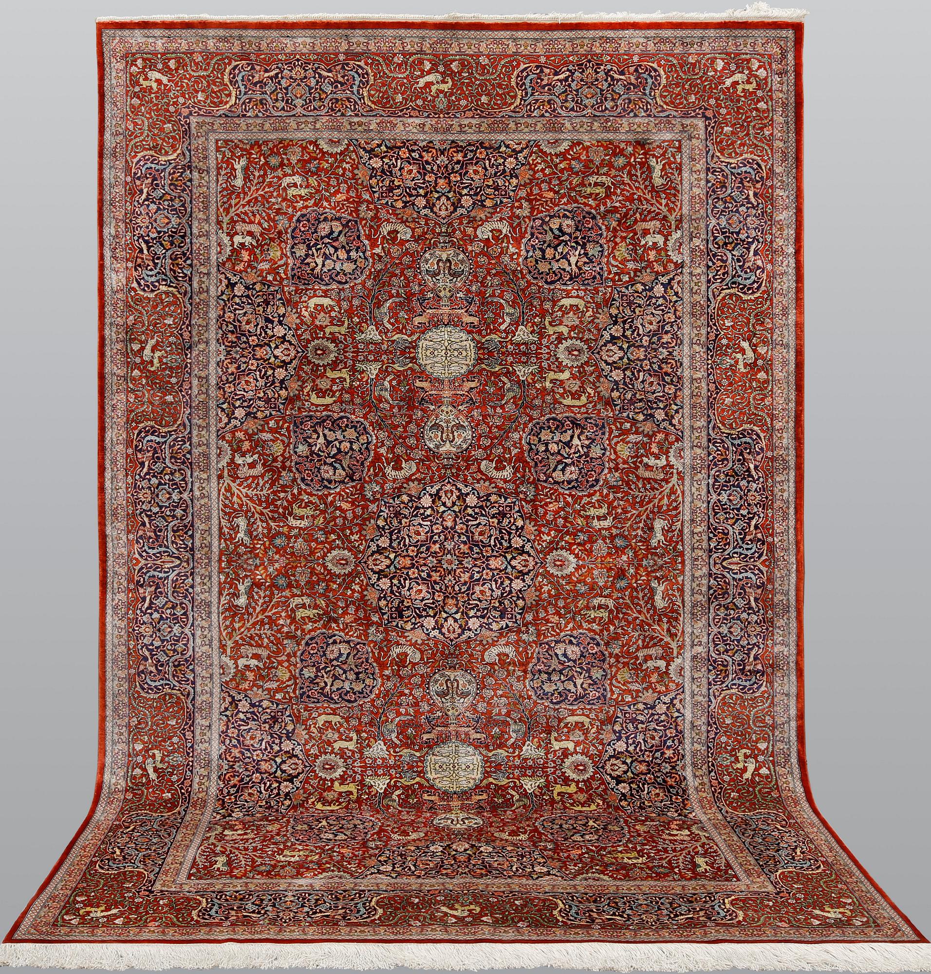 A pictoral orietal silk rug, 246 x 153 cm.