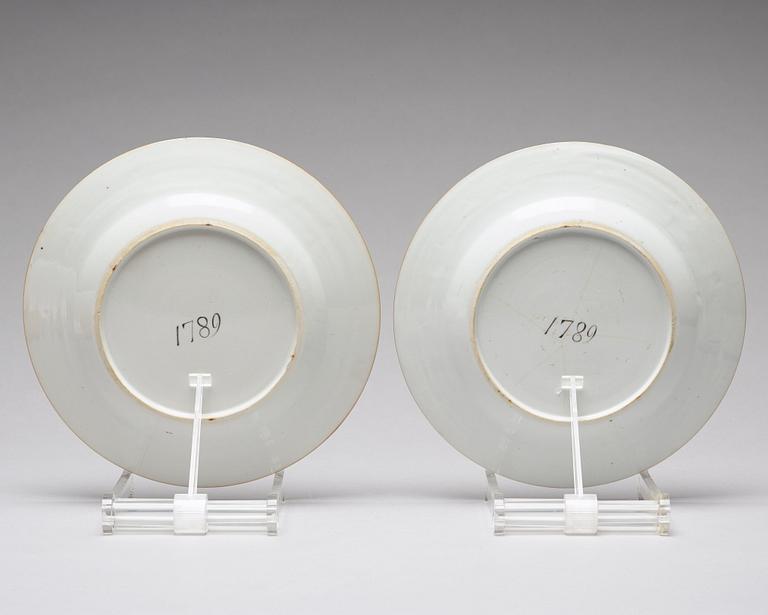 A pair of blue and white plates, Qing dynasty, Qianlong (1736-95). With the year 1789 written to the reverse.