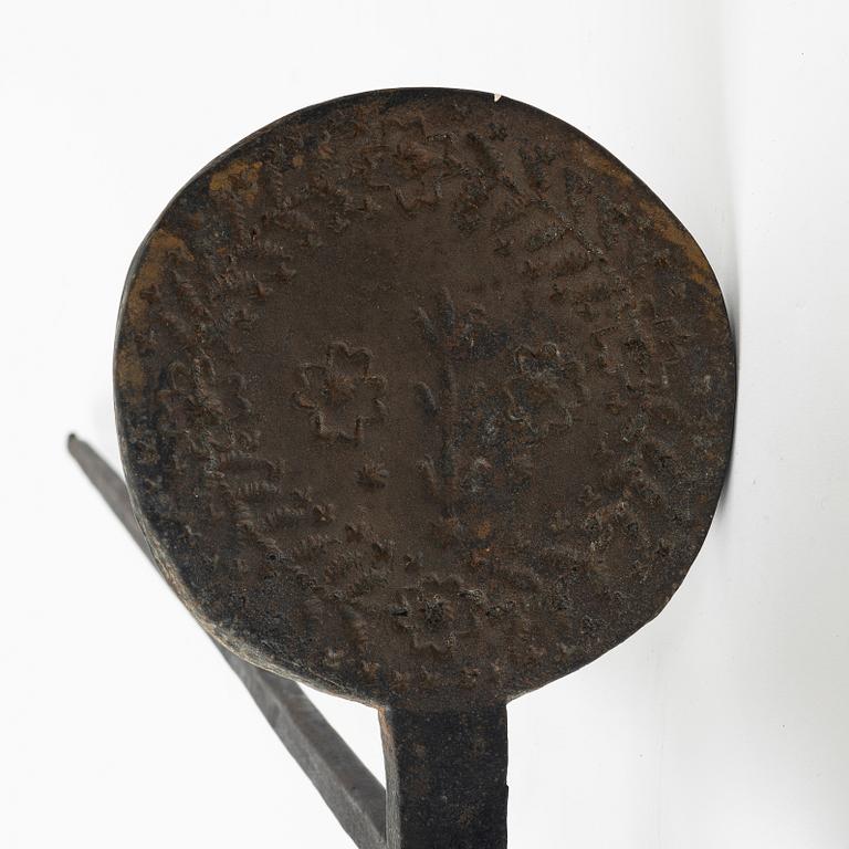 An iron wafer maker, dated 1662.