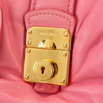 MIU MIU, a pink leather bag.