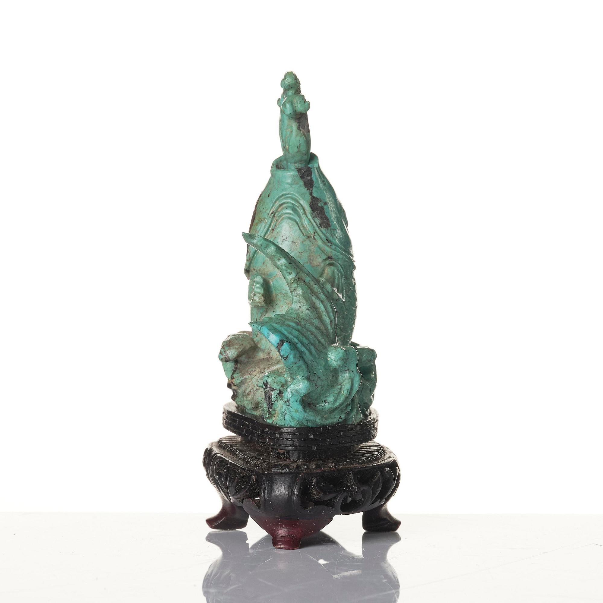 A well sculptured turquoise figure of a carp, Qing dynasty, 19th century.