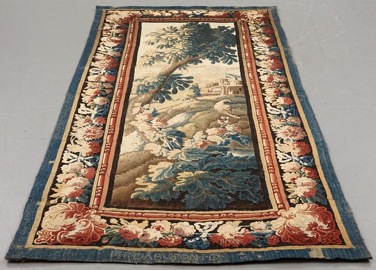 A tapestry, "Verdure", tapestry weave, a so called "entre-fenêtre", ca 295-296 x 126-129,5 cm, signed M.R.DABVSON.i.D.