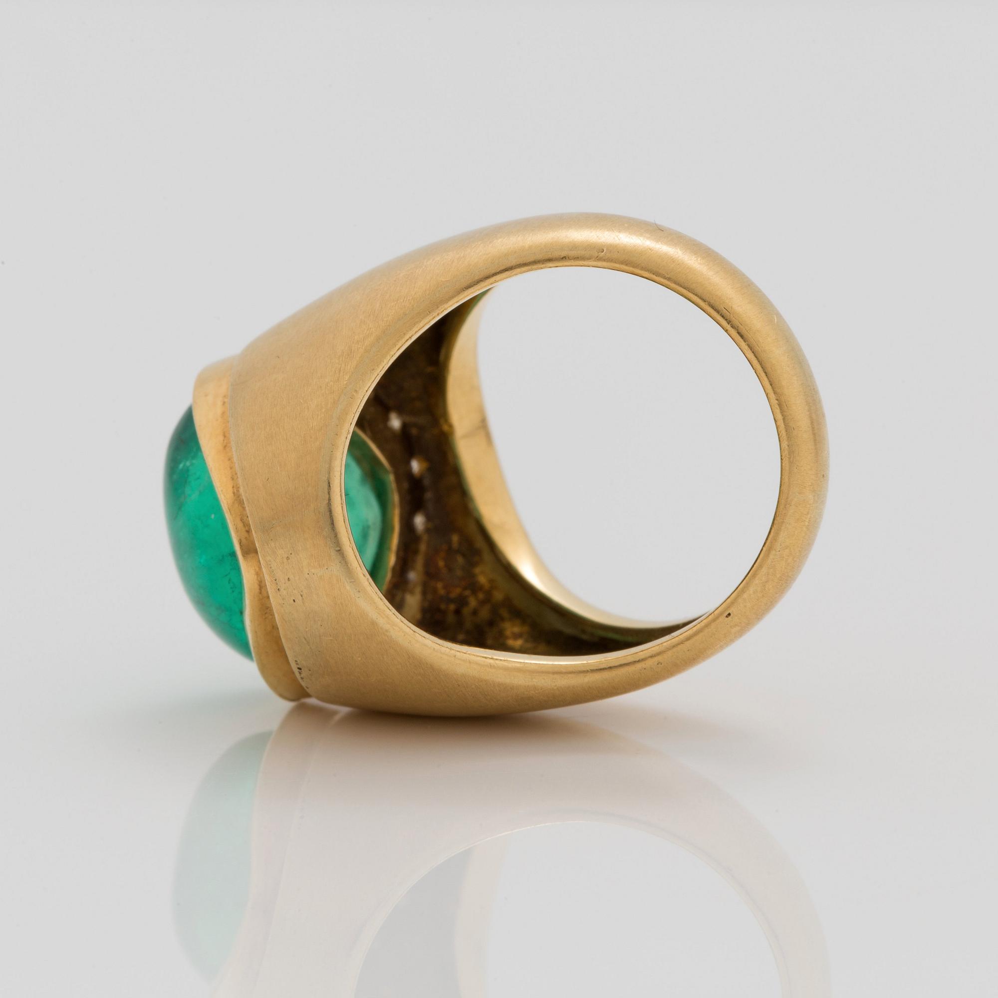 A circa 12.00 ct cabochon cut emerald and brilliant cut diamonds signed Cartier.