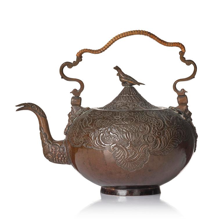 A German Rococo repoussé copper teapot, mid 18th century.