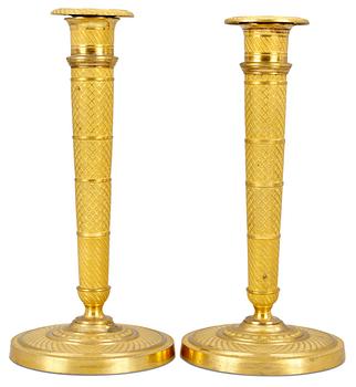 968. A pair of Empire candlesticks.