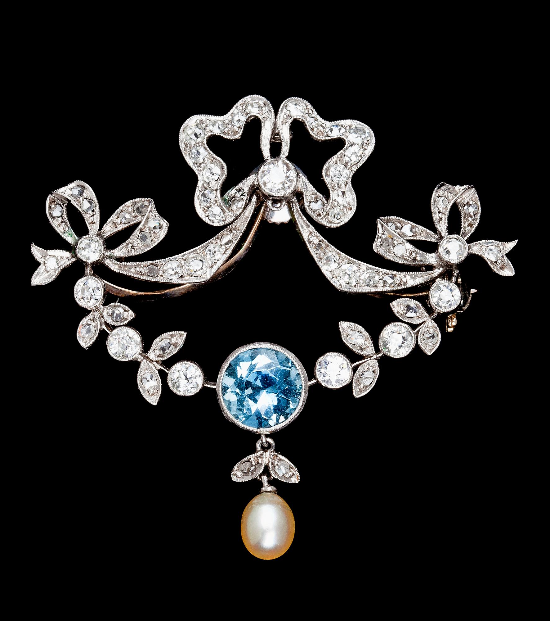 A platinum, diamond and aquamarine brooch, 1900.