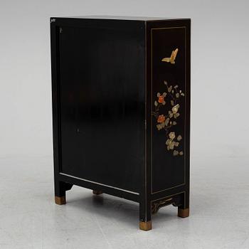 A Chinese black lacquered cabinet, 20th century.