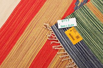 A Durry carpet, c. 300 x 200 cm.
