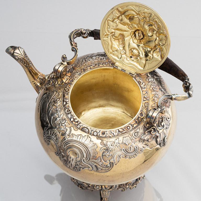 An English silver-gilt teapot with stand and burner, mark of Richard Sibley I, London 1825.