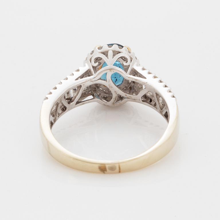 Oval faceted kyanite and diamond ring.