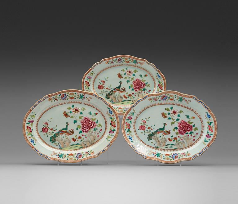 Two larger and one small famille rose 'double peacock' serving dish, Qing dynasty, Qianlong (1736-95).