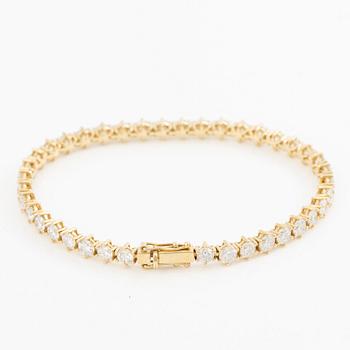 Tennis bracelet in 18K gold with brilliant-cut diamonds.
