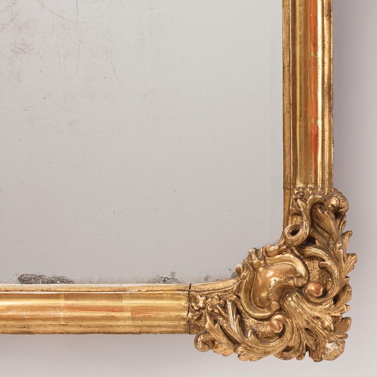 A presumably German giltwood rococo mirror, mid 18th century.