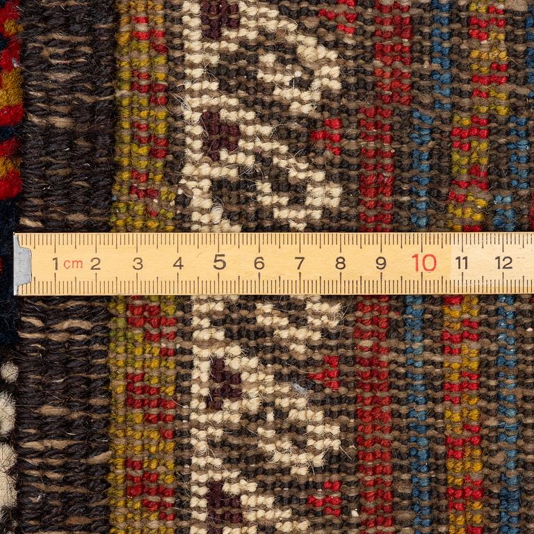 An antique Baluch rug, east Persian, ca 203 x 101 cm.