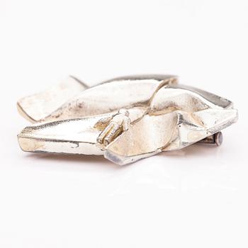 BJÖRN WECKSTRÖM, A sterling silver brooch "The stranger on Io". Lapponia 1974.