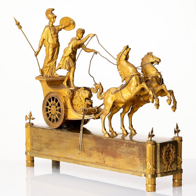 A French Empire early 19th century gilt bronze mantel clock, marked J Langlois à Paris.