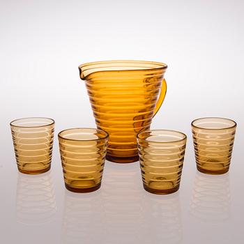 A 1930's 'Böljeblick' pitcher and a set of four drinking glasses for Karhula  Glassworks, Finland.