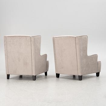A pair of easy chairs, 21st century.