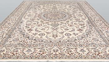 A Nain part-silk carpet, 395 x 293 cm.