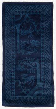 An antique Baotou rug, North China, c 157 x 75 cm.