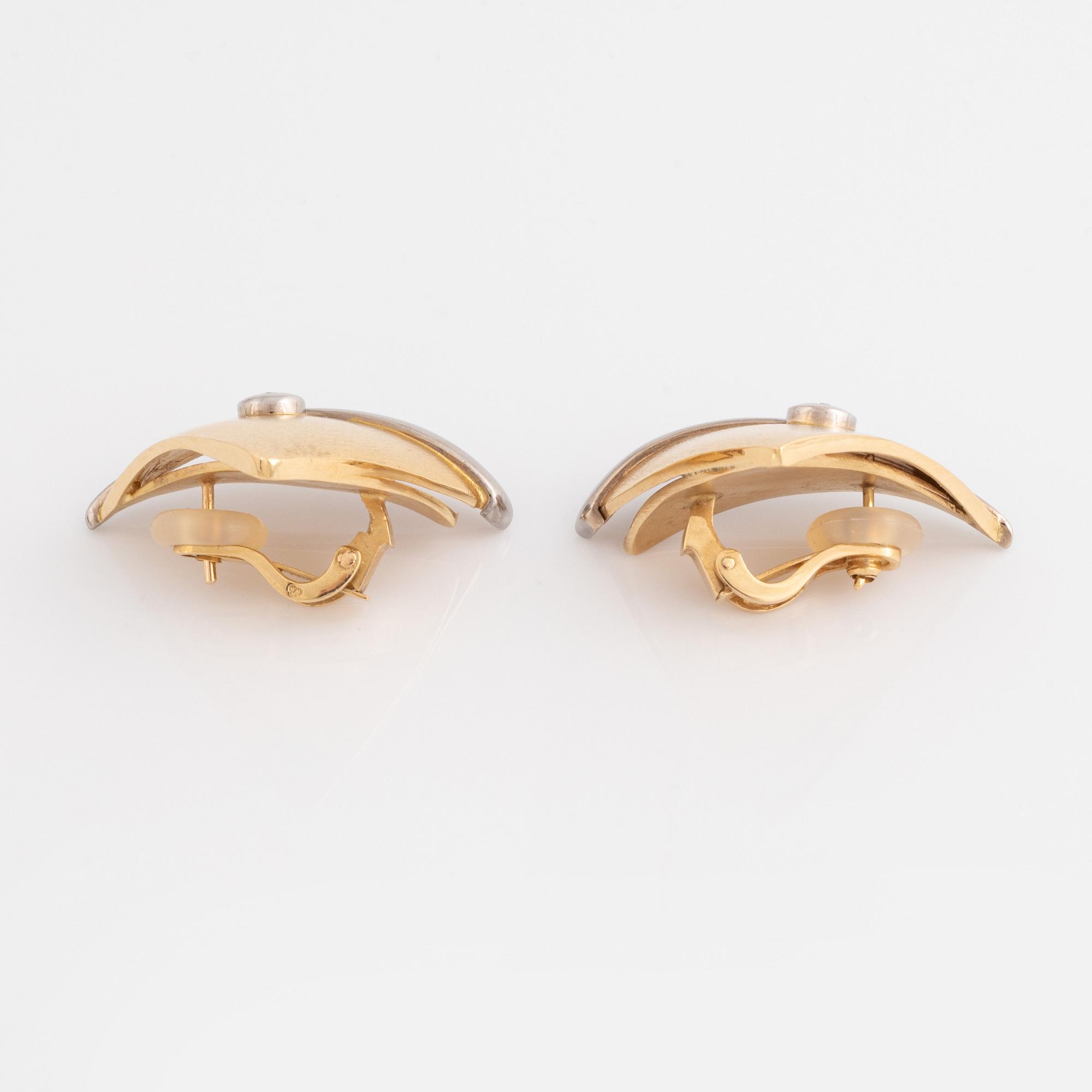 A pair of 18K gold Ole Lynggard earrings set with round brilliant-cut diamonds.