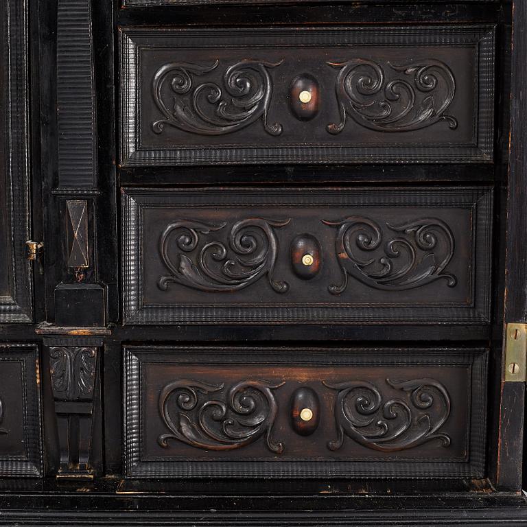 A South-German Baroque ebonized collector's cabinet on stand, circa 1700.