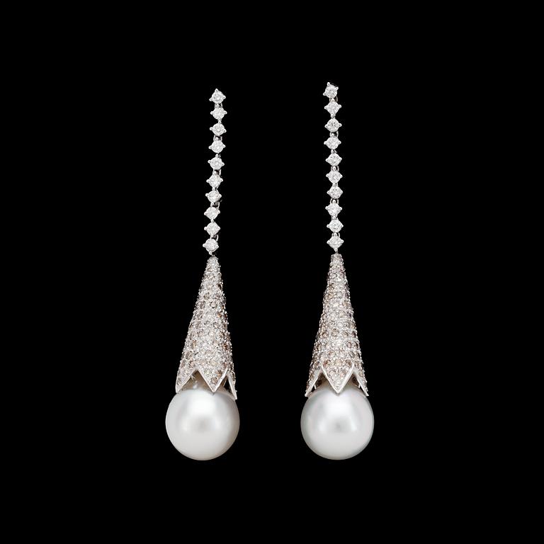 A pair of cultured south sea pearl, 13,5 mm, and brilliant cut diamond earrings, tot. 6.50 cts.