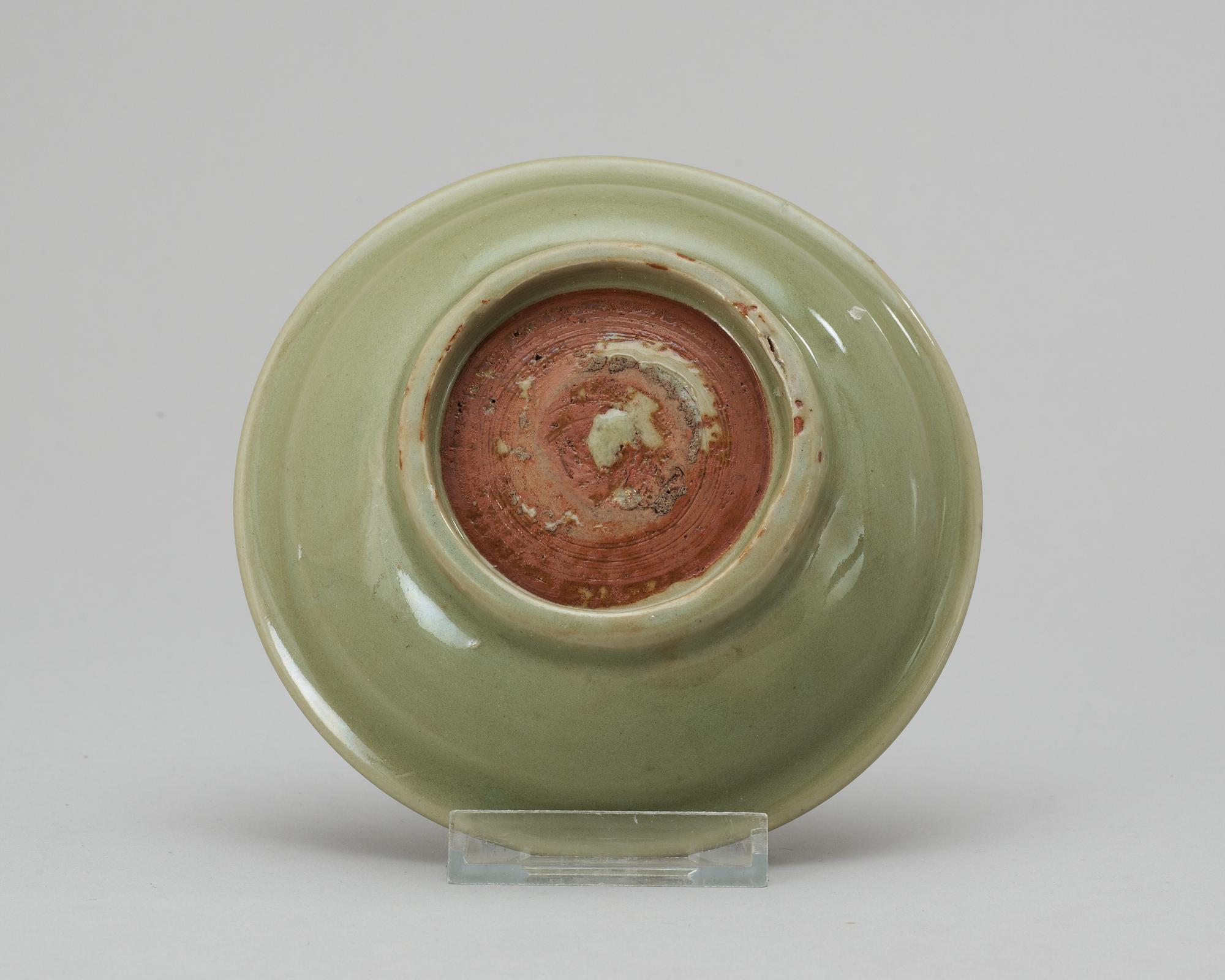 A celadon green Ming plate.