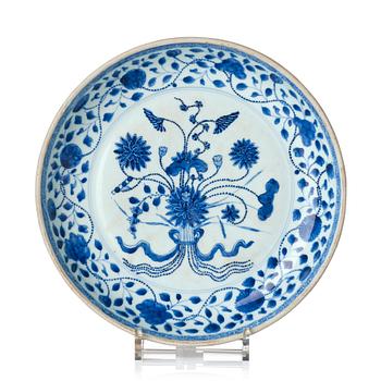 1104. A blue and white ming-style 'lotus bouquet' dish, Qing dynasty, 18th century.