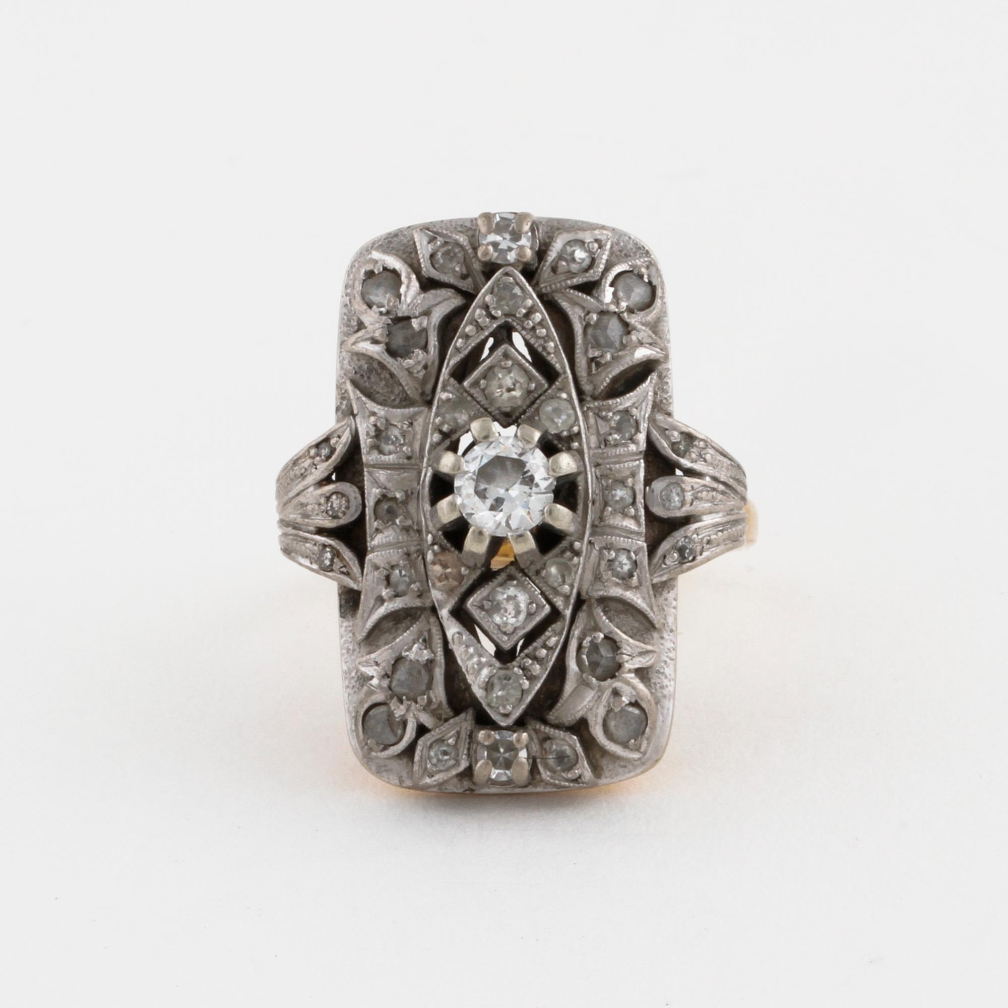 A facet cut diamond ring.