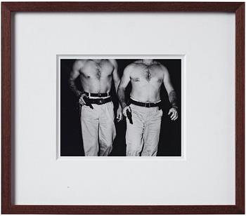 Weegee, "Two police officers who dove into the Hudson RIver to save Donna Landon, New York, July 20 1941".
