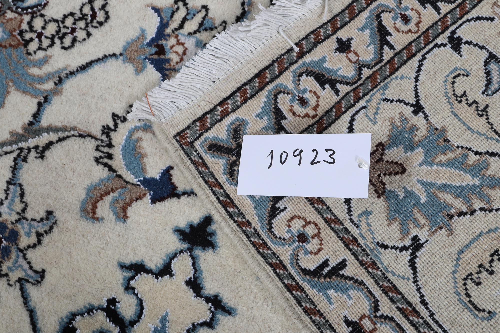 A rug, Nain, part silk, 238 x 163 cm.